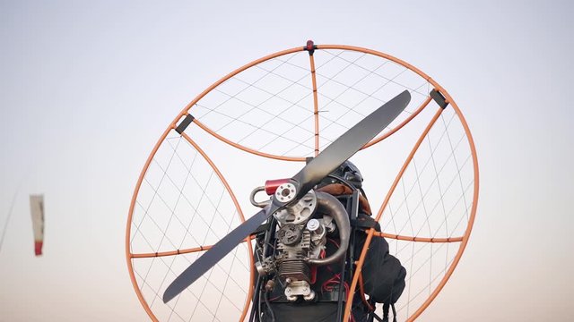 Pilot Paraglider preparing to take off