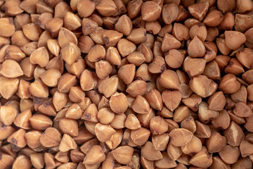 Buckwheat groats close-up, macro. Buckwheat natural pattern. Diet and healthy nutrition concept.