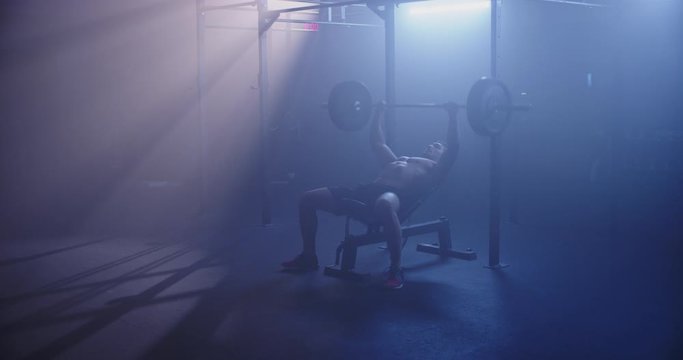 Male weightlifter doing bench press