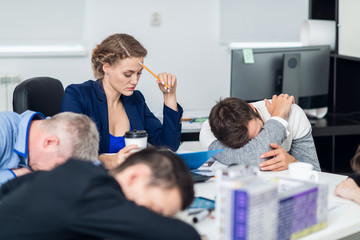 A young business woman trying to concentrate in the office, whil