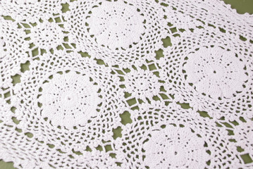 White lace doily background. Patterned lace table cover