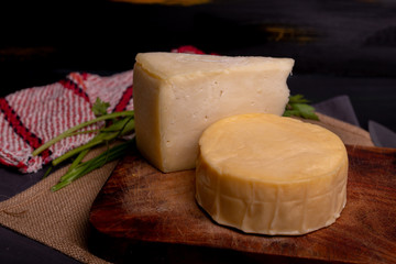 Delicious cheese in a wheel ready to eat or enjoy in an afternoon with friends