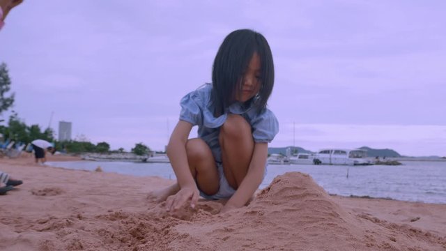 Asian children joy to play on the beach