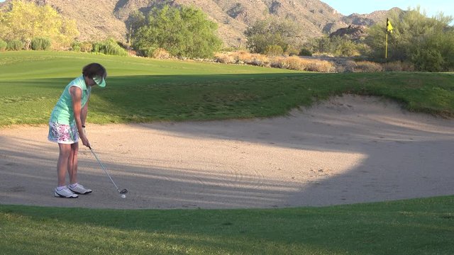 Woman Golfer in a Sand Trap