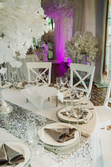 Beautiful wedding table setting with floral decorations