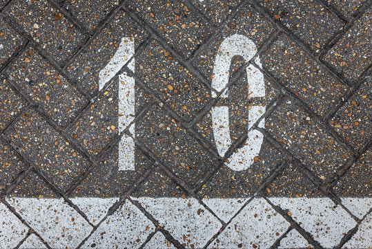 Number ten on the street pavement