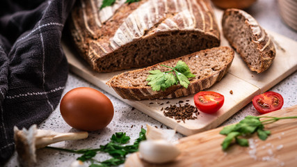Background with bread, rolls, vegetables and herbs, 