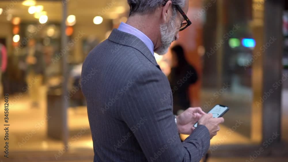 Poster intelligent man in formal wear holding smartphone and installing application for chatting connected 