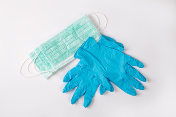 Coronavirus or Covid -19 pandemic equipment protective safety , protection gloves , surgical mask  on white background.