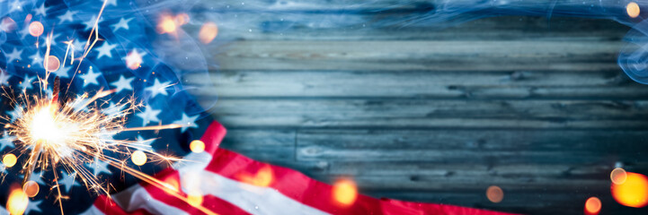 Happy 4th Of July - American Flag With Sparkler And Smoke On Wooden Background - Independence Day Celebration Concept - obrazy, fototapety, plakaty