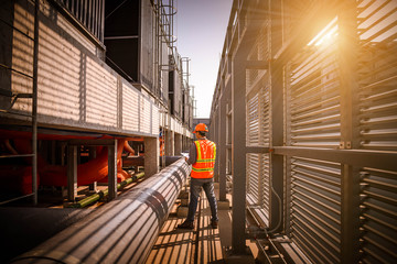 A engineer under checking the industry cooling tower air conditioner is water cooling tower air...