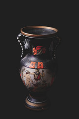 greek pottery on a black background