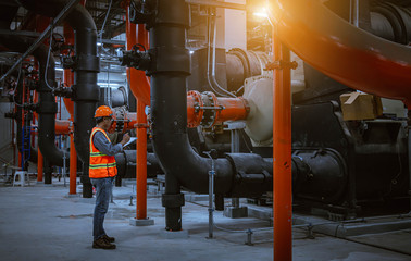 A engineer under checking the industry cooling tower air conditioner is water cooling tower air...