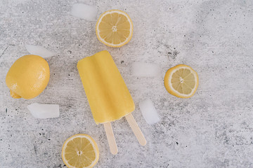 Yellow lemon popsicle with ice