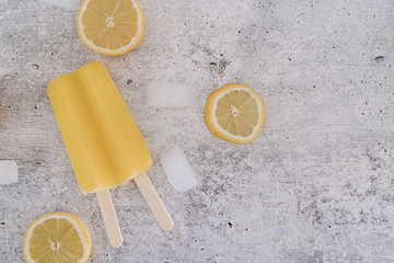 Yellow lemon popsicle with ice