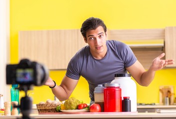 Young man blogging about food supplements