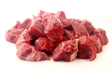 pile of diced chopped raw beef cube isolated on white background