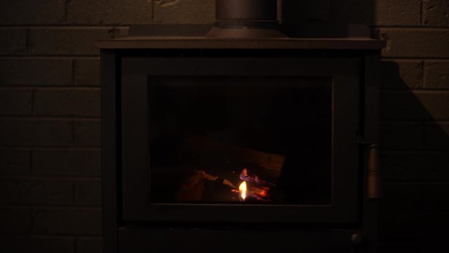 A convection fireplace with burning wood.