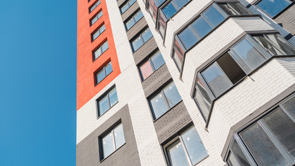 Modern apartment buildings on a sunny day with a blue sky. Facade of a modern apartment building. residential building modern apartment condominium architecture