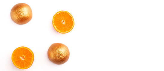 Diet concept. Fresh citruses in gold paint