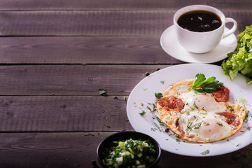 Fried eggs with green and vegetables. Helthy and delicious Breakfast.
