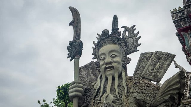 Time Lapse of Clouds Above Guard Keeper Sculpture in Wat Pho Temple, Bangkok, Thailand