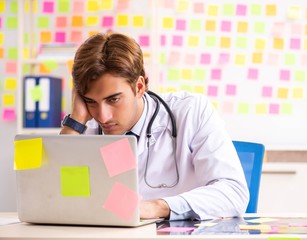 Male doctor with many conflicting prioritites