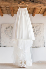 Fototapeta na wymiar White wedding dress and accessories