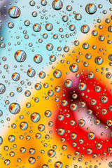 girl with a microphone through the drops of water