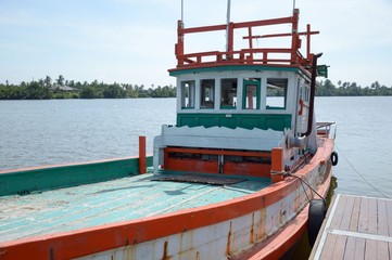 Fototapeta na wymiar wooden fishing boat on the river