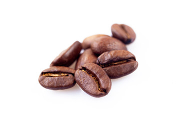 Roasted coffee beans close up ,isolated in white background