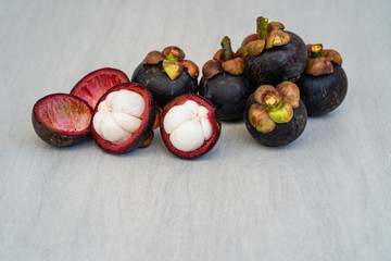 Pile Mangosteen on white table. 