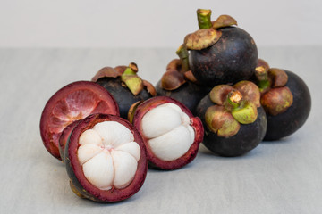 Pile Mangosteen on white table. 