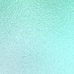Mint green foil paper texture background.