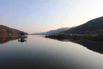 Landscape of a floating house in the beautiful reservoir of the morning