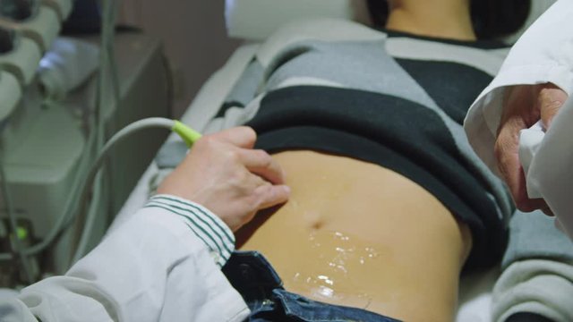 CS CU Doctor performing ultrasound examination on female patient