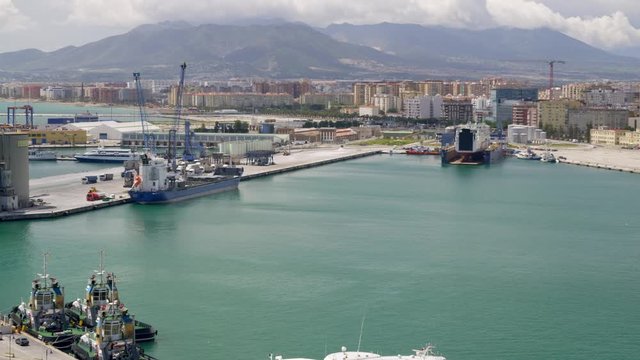 WS Malaga harbor, Huelin quarter of town and mountains in background
