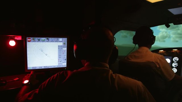 MS PAN Instructor and pilots in professional flight simulator during flight
