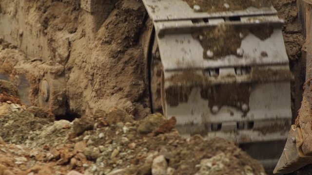 CU TS Bulldozer tracks moving through dirt