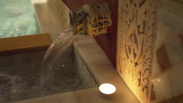 CU Water pouring into bathtub in traditional Arab&nbsp;bathhouse&nbsp;(hammam)