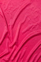 red silk sheet with creases