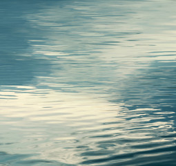 smooth natural water background sun light on the sea or ocean,vintage and soft colored background water ripple background