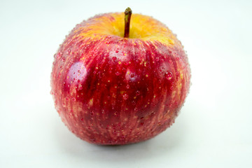 Isolated Apple on white closeup with Dew