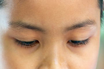 Close-up of eyebrows and eyes of Asian women in Thailand.