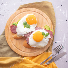 breakfast toast with avocado, scrambled eggs and ham
