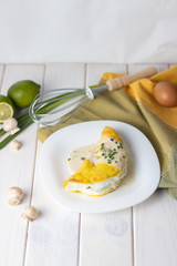 souffle omelette with cream sauce and mushrooms