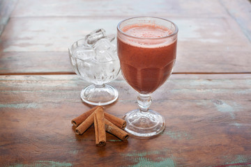 Natural organic fruit juice in glass cup with blurred background