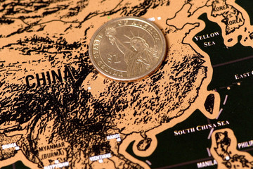 luxury travel scratch map of blogger with one dollar coin