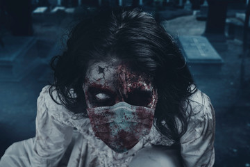 Creepy female zombie wearing face mask