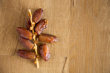 Kurma or dates on wooden background